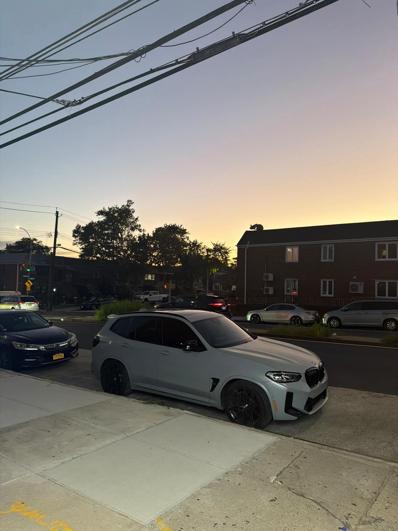 Gray BMW X3 M Competition shown from the side three-quarter angle