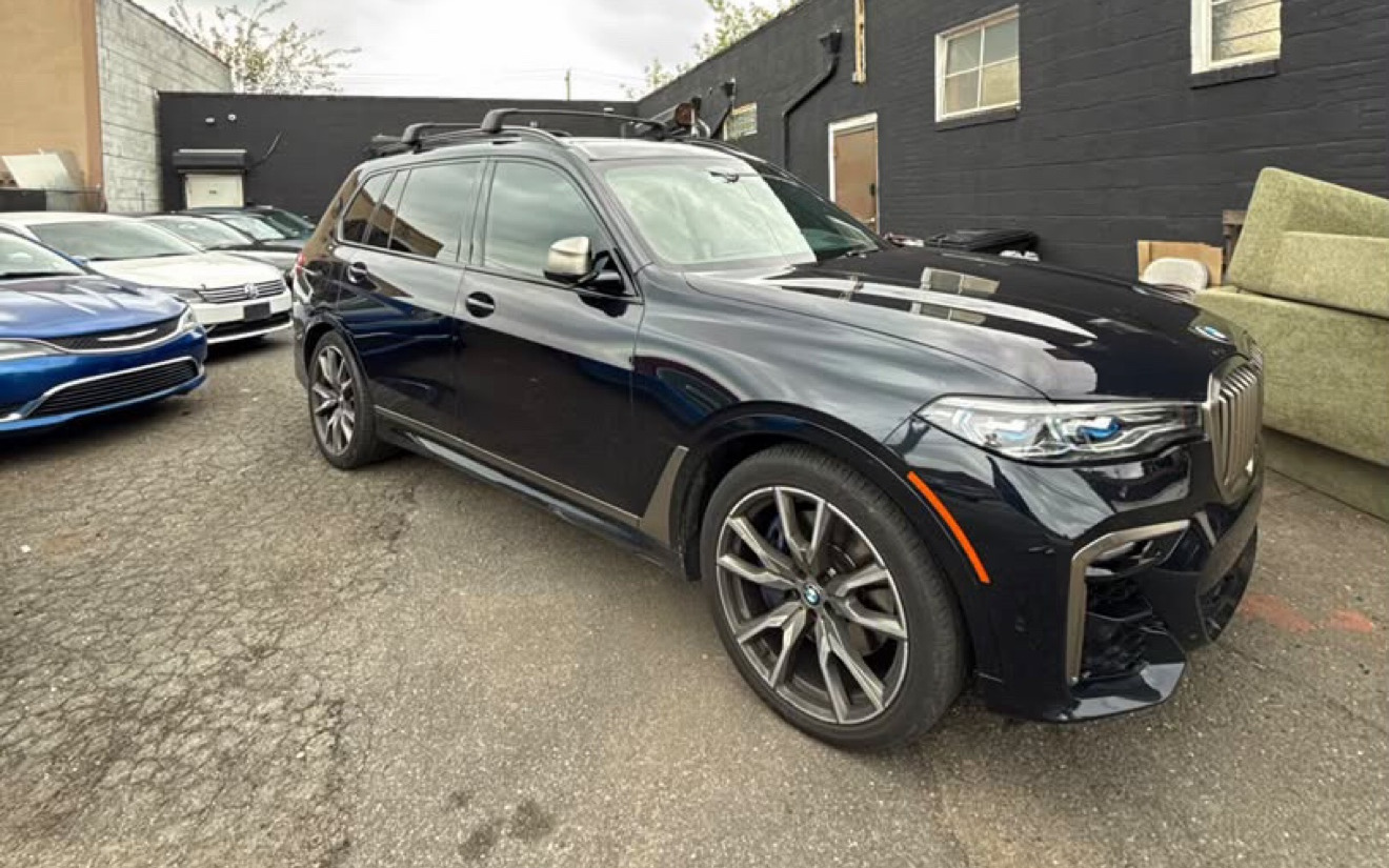 BMW X7 M50i · Black rental in NYC