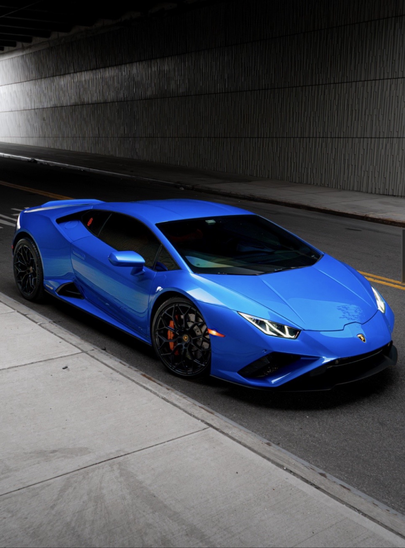 Lamborghini Huracán Evo in Blu Eleos shown from the front three-quarter angle