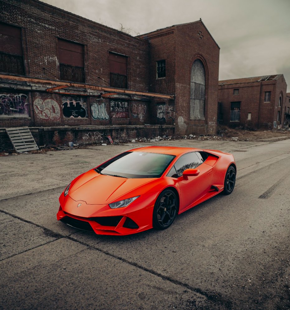 Red Lamborghini Huracán Evo shown from the front three-quarter angle