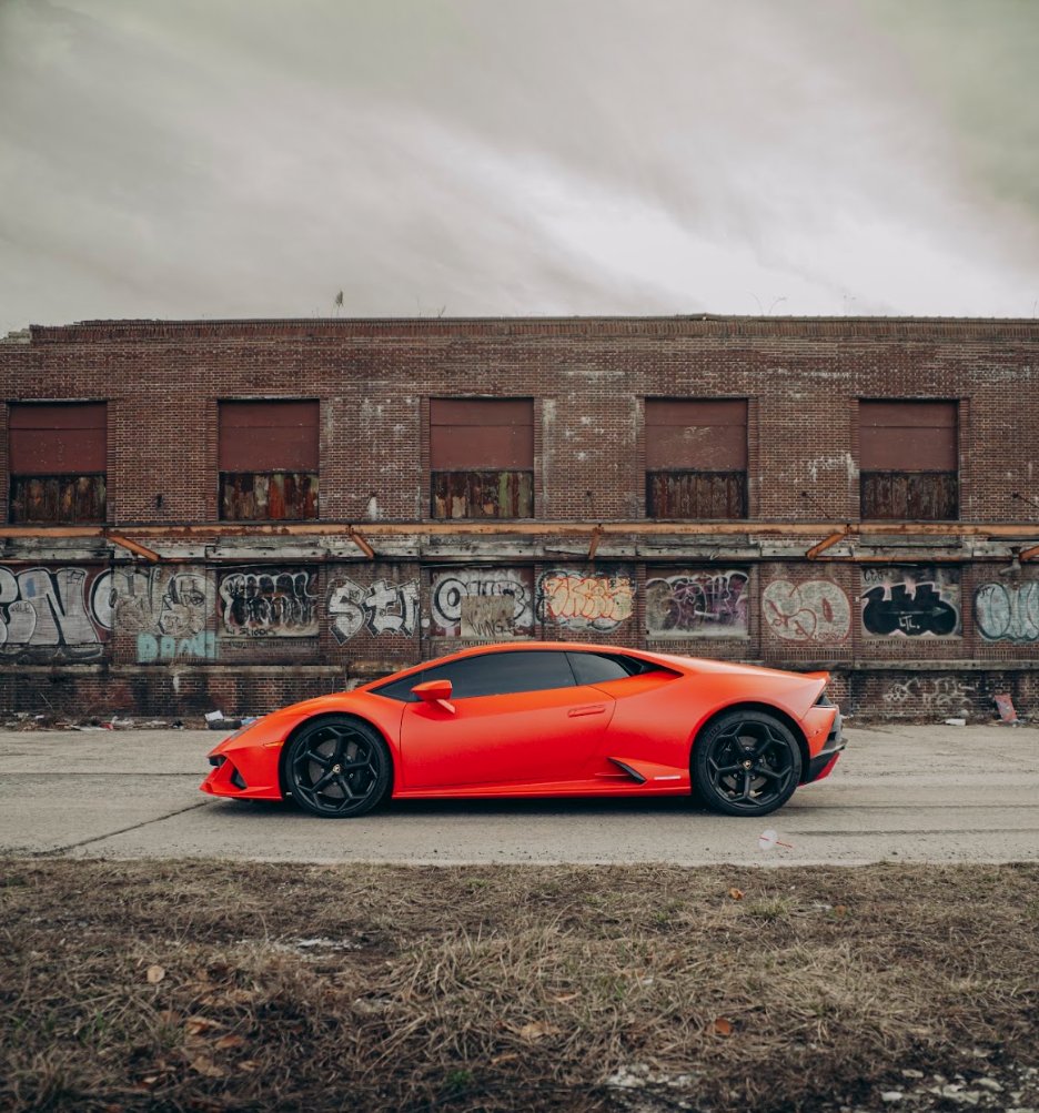 Side profile of the red Lamborghini Huracán Evo