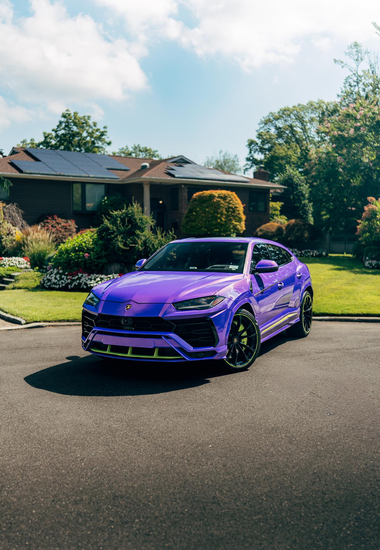 Purple Lamborghini Urus shown from the front three-quarter angle