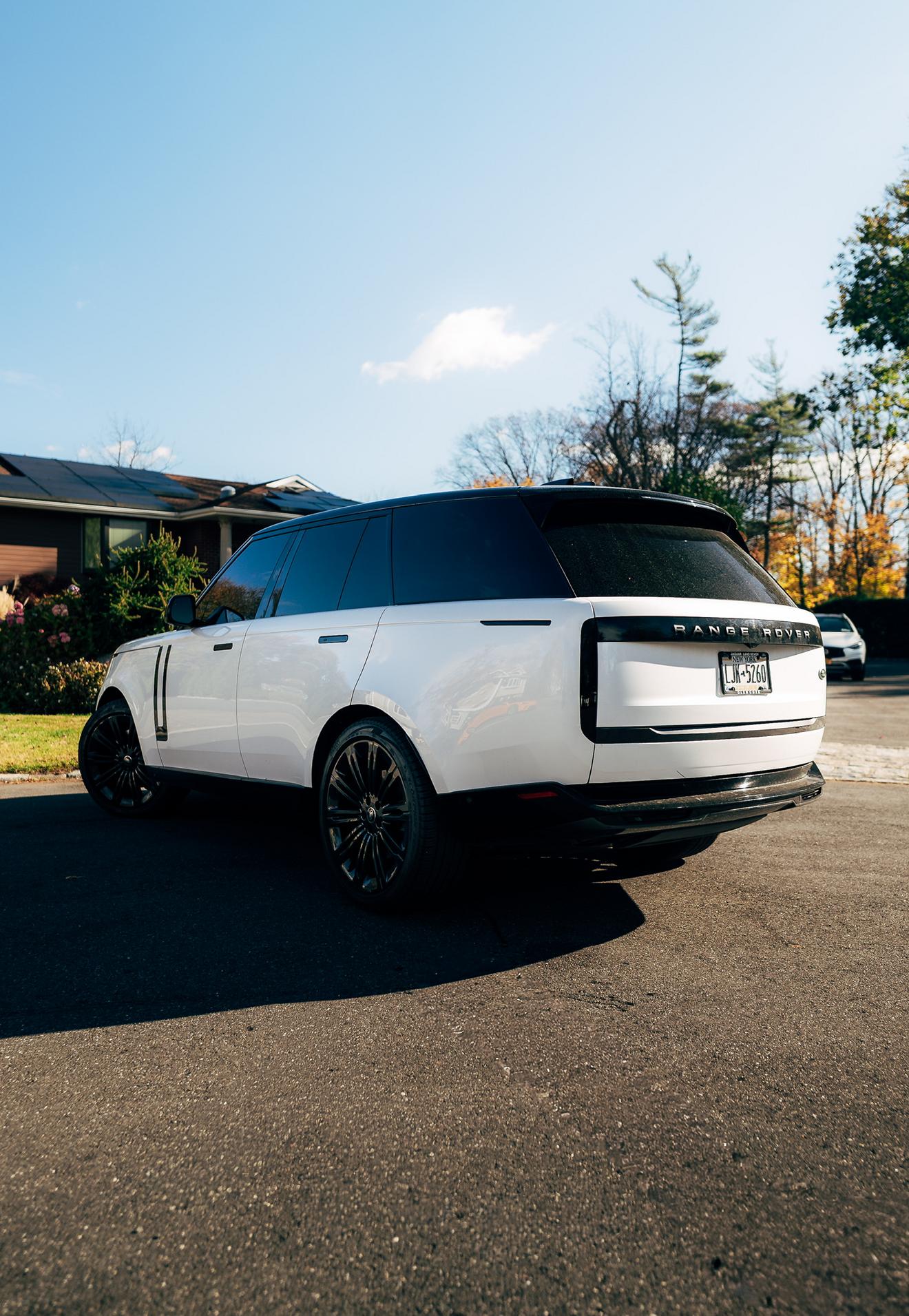 White Range Rover shown from the rear three-quarter angle