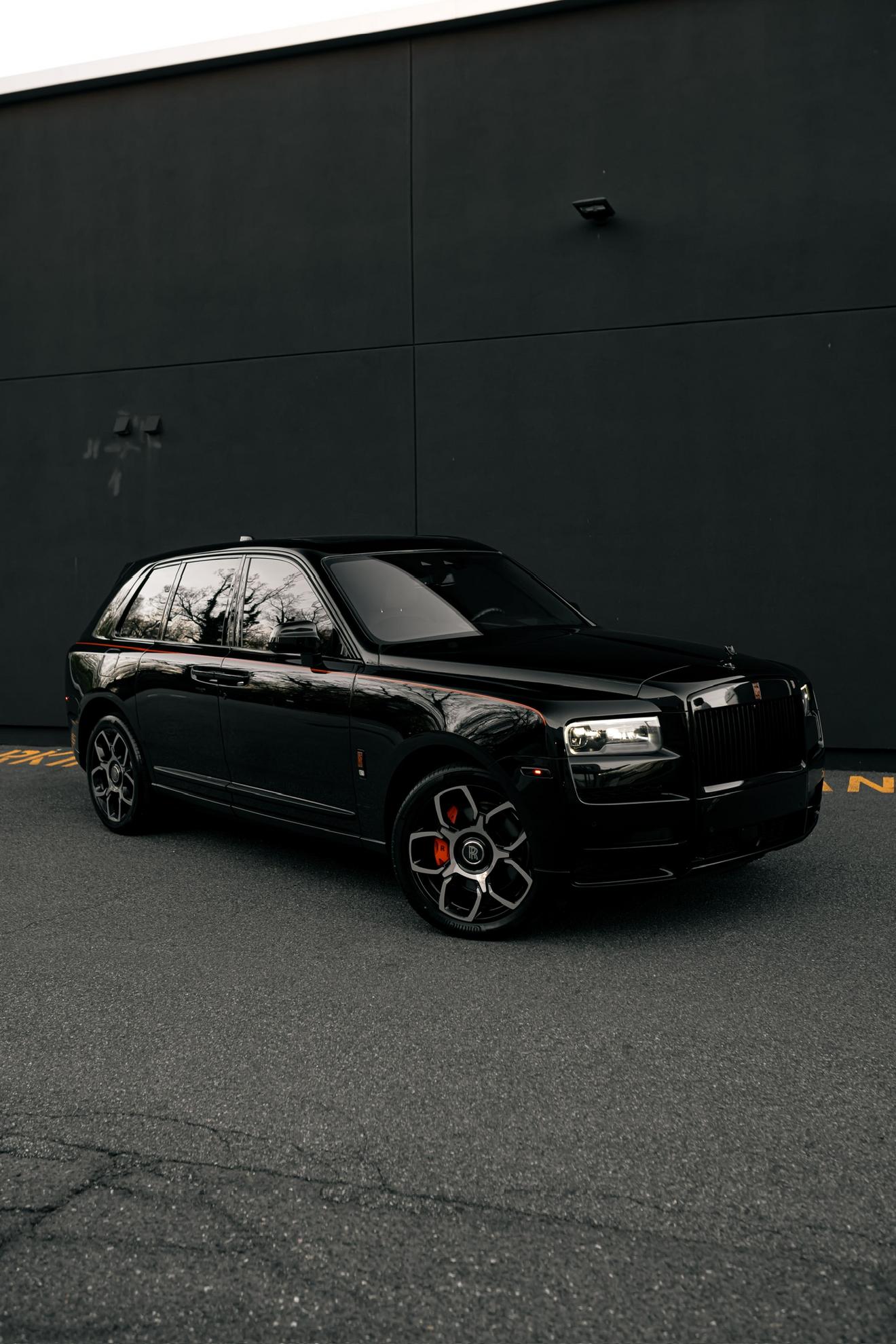 Black Rolls-Royce Cullinan shown from the front three-quarter angle