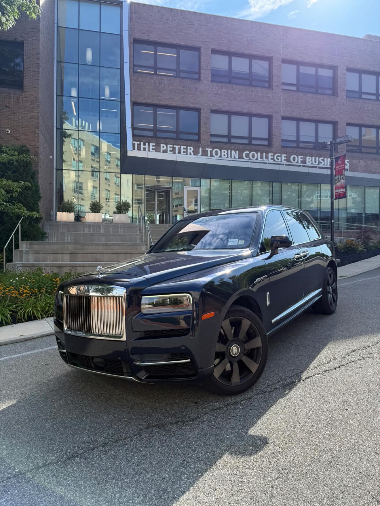 Black Rolls-Royce Cullinan shown from the front three-quarter angle
